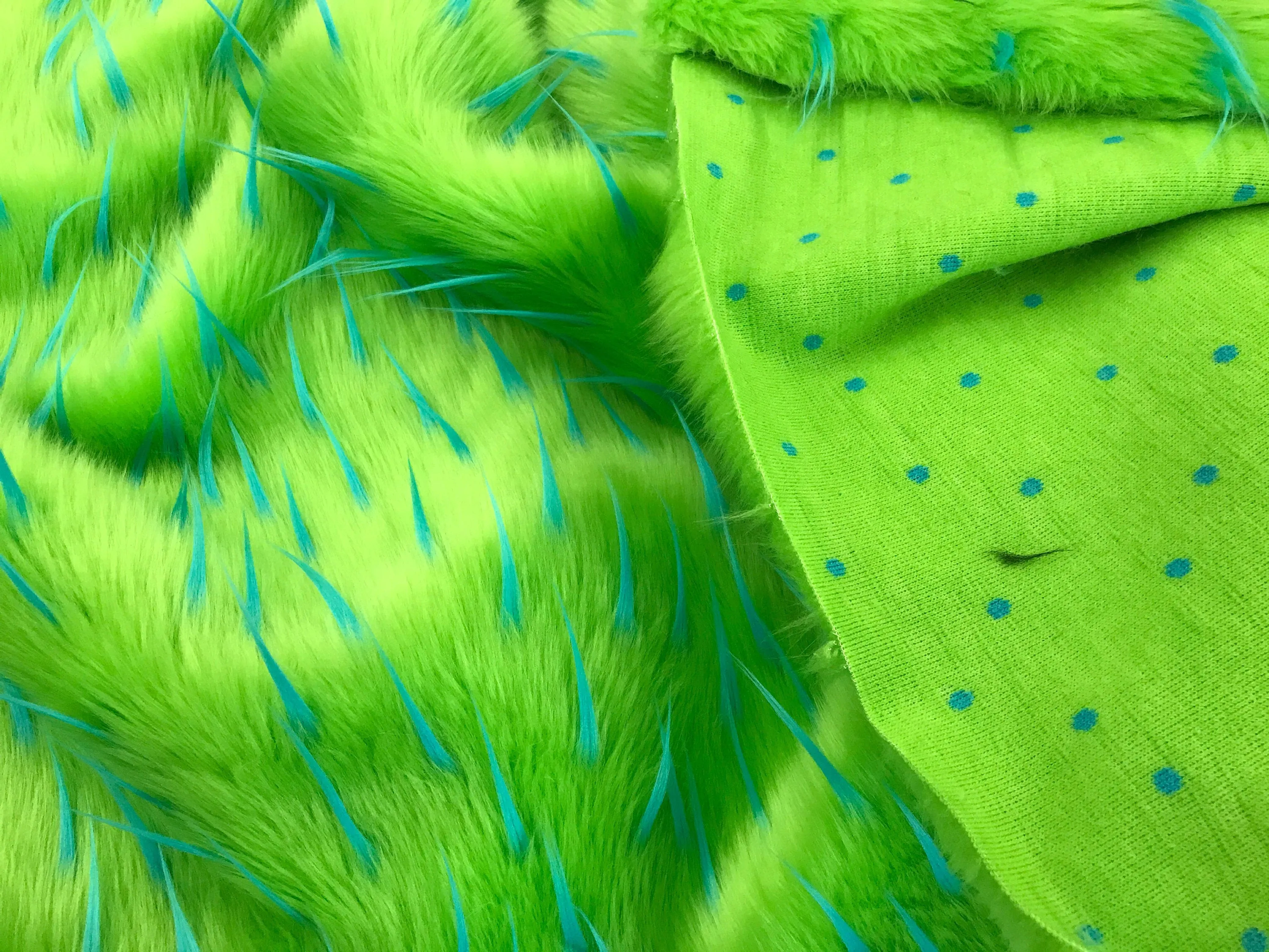 Turquoise spikes on a green faux fun fur-multi color-60" wide-fashion-decorations-jackets-apparel-upholstery-sold by the yard.