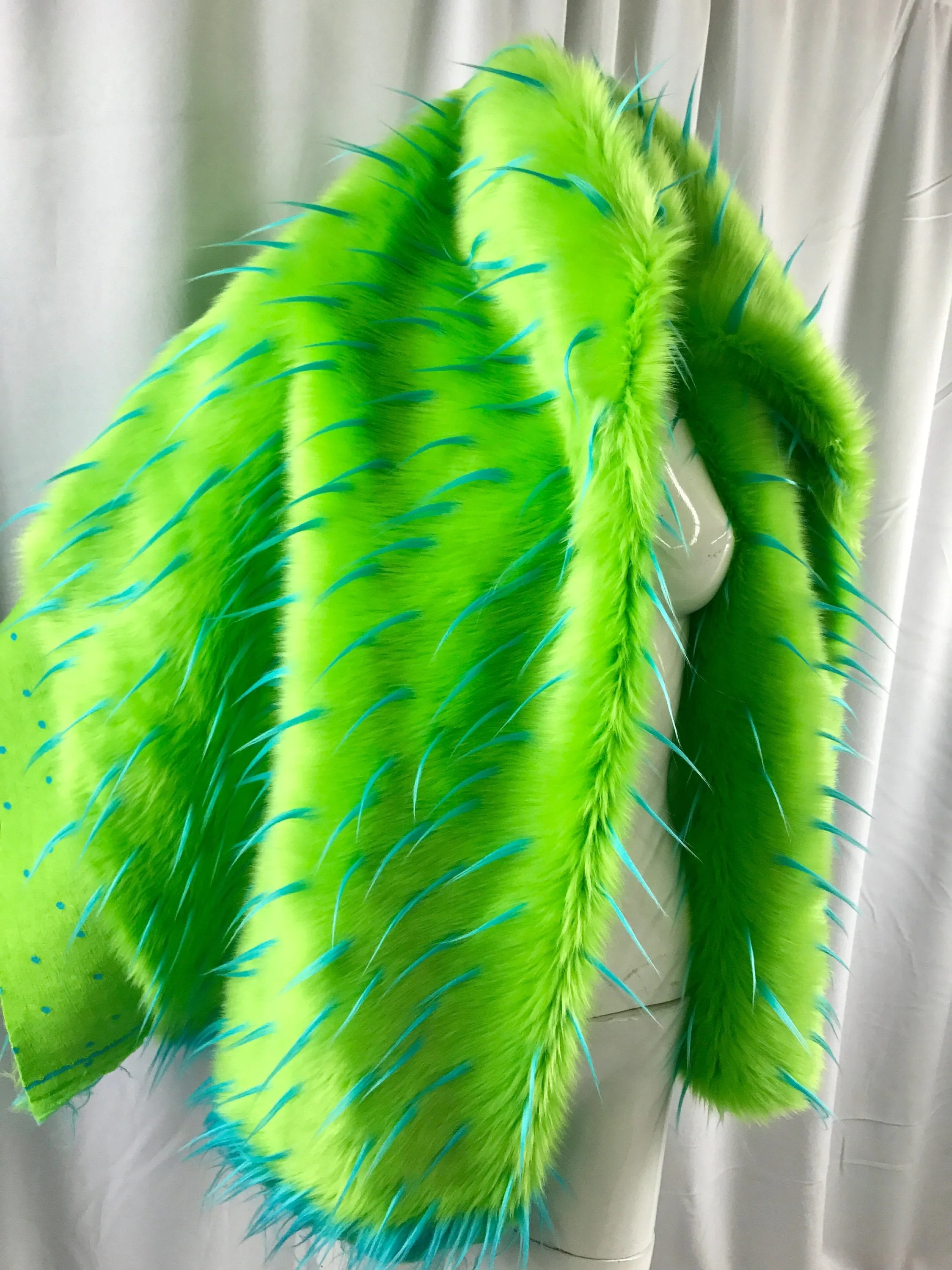 Turquoise spikes on a green faux fun fur-multi color-60" wide-fashion-decorations-jackets-apparel-upholstery-sold by the yard.